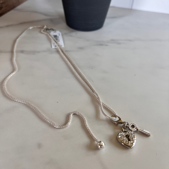 3/$25 Guess Modern Silver & Crystal Detailed Key and Lock 32” Adj Necklace - Picture 4 of 6